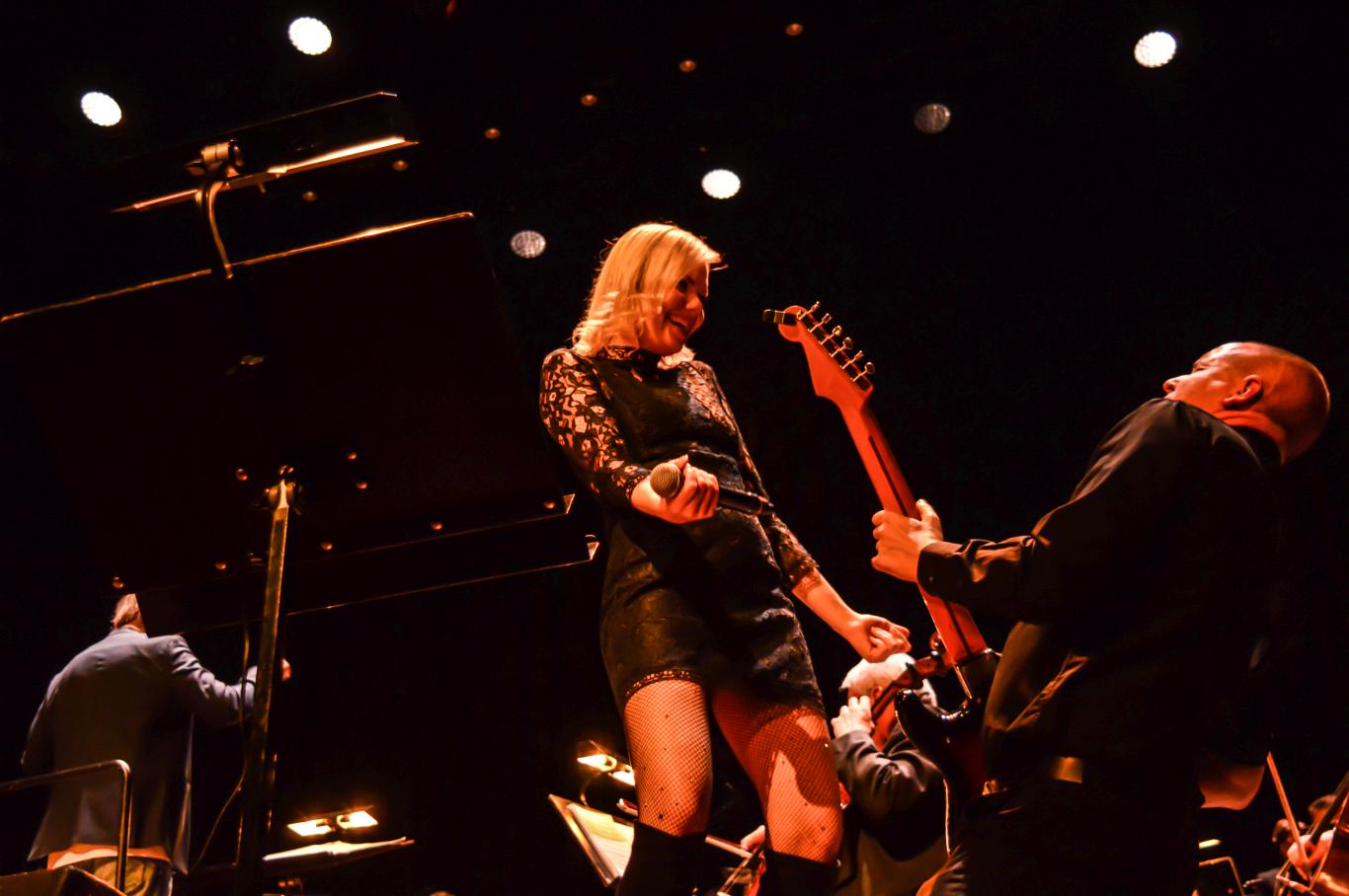 Singer and guitarist under spotlights